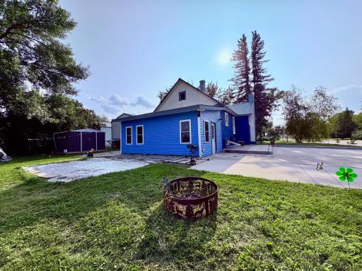 Back of home with bonfire ring