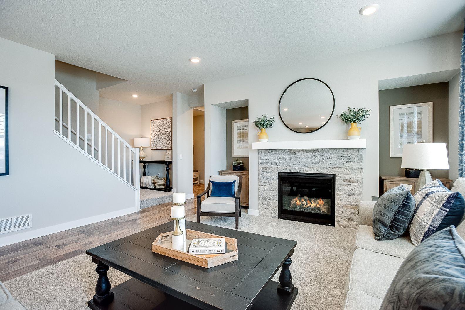 Gas fireplace with stone surround.
