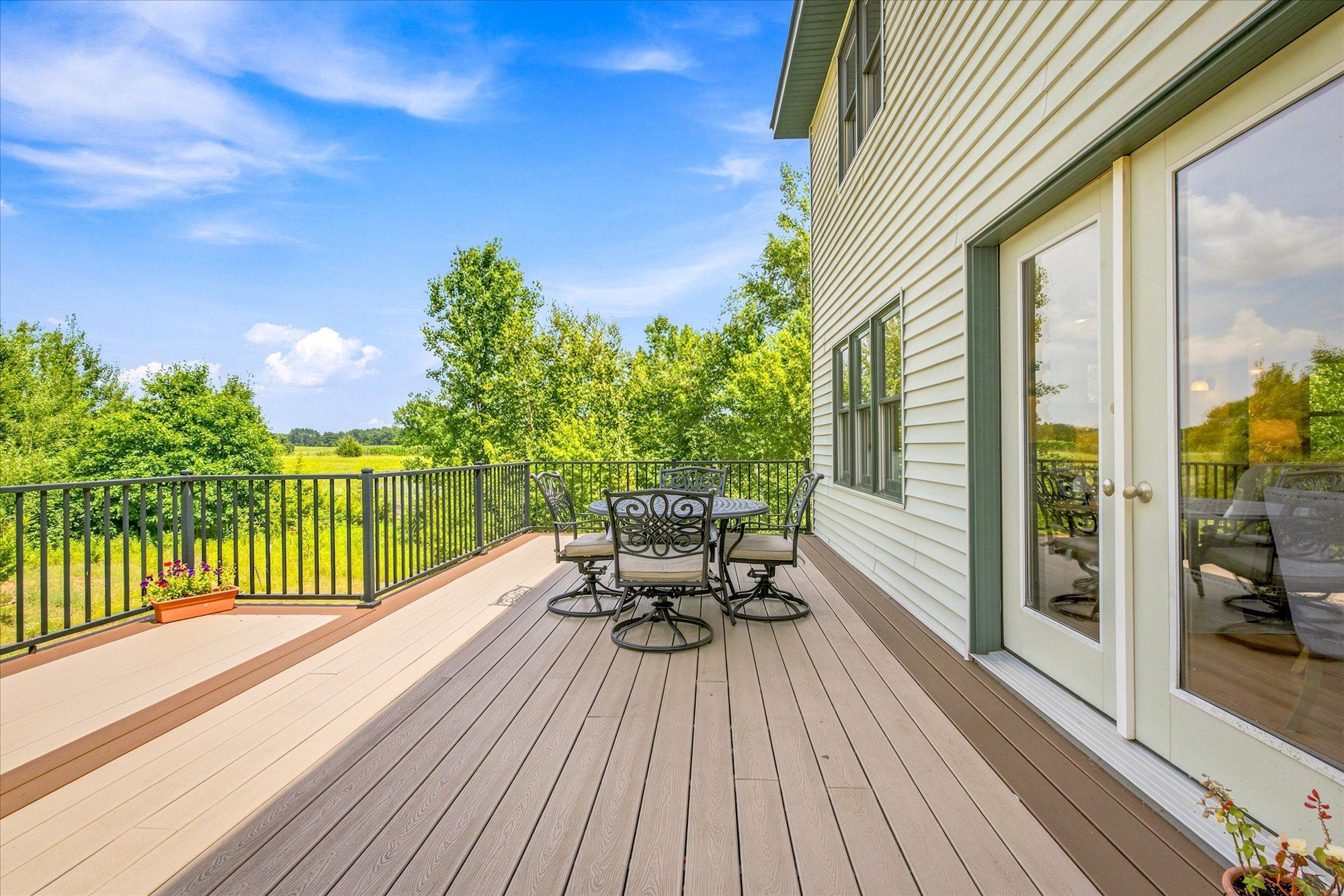 Dining leads to large, maintenance free deck