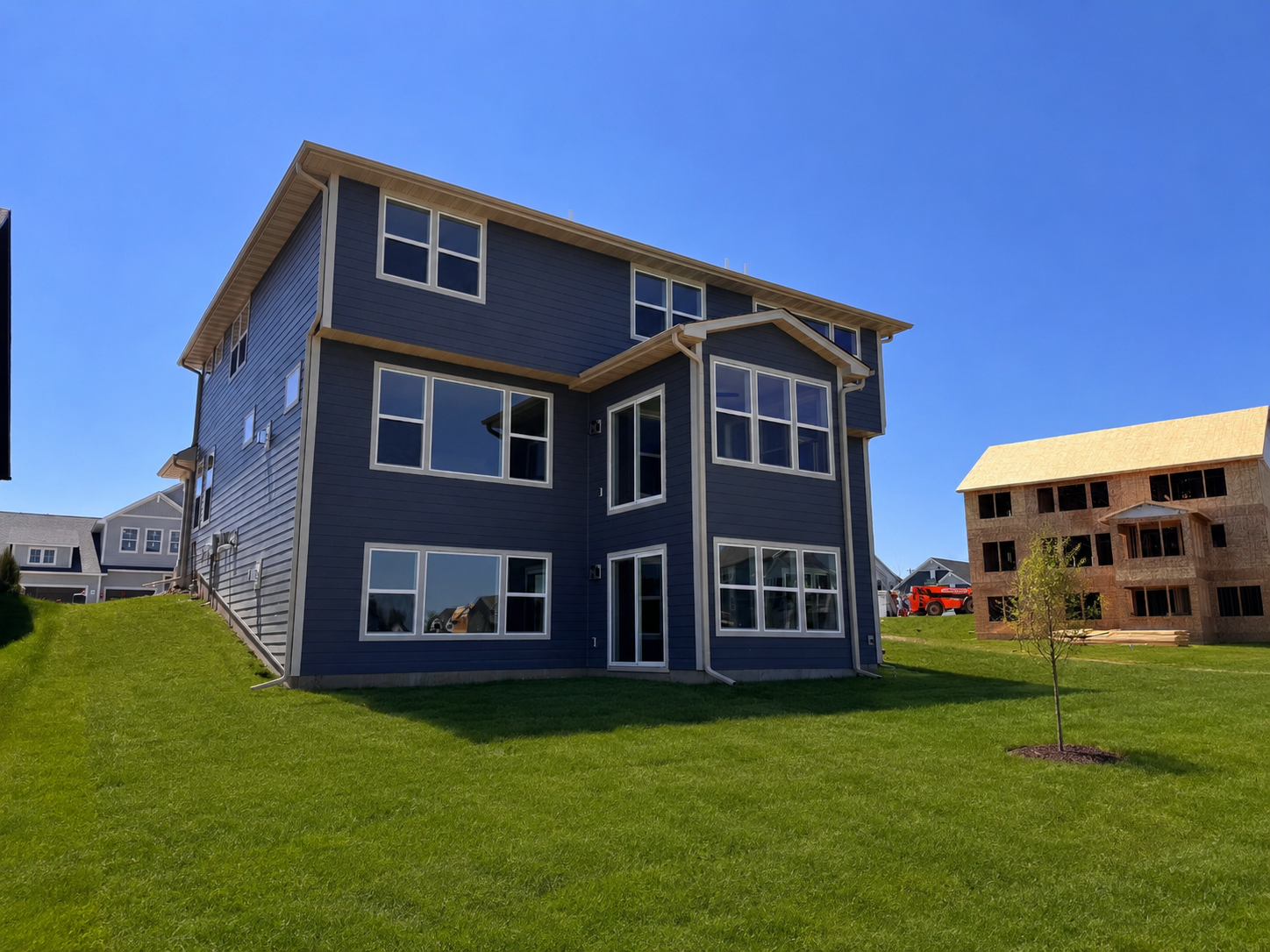 Rear exterior of the home *Photo grass is virtually staged