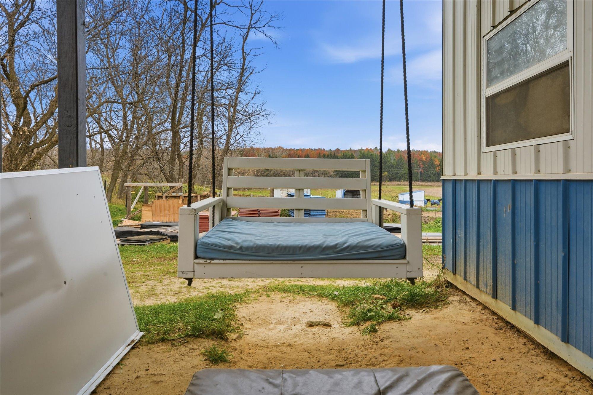 Porch swing on barn