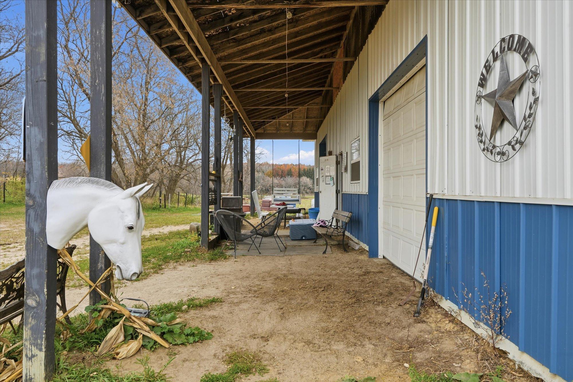 Covered area for large barn door