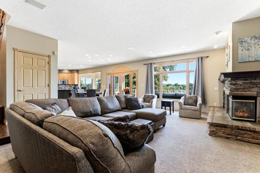 Great room overlooks the lake and sits between the informal dining and main floor office.
