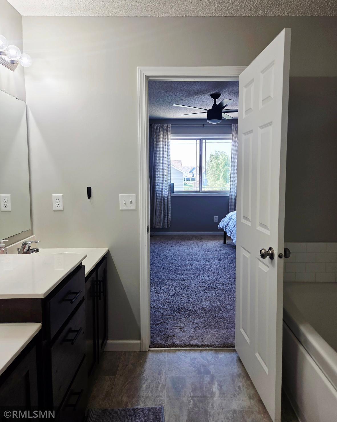 Master bathroom looking into bedroom