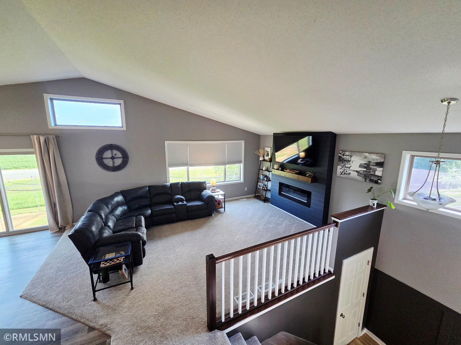 Main level living room with electric fireplace