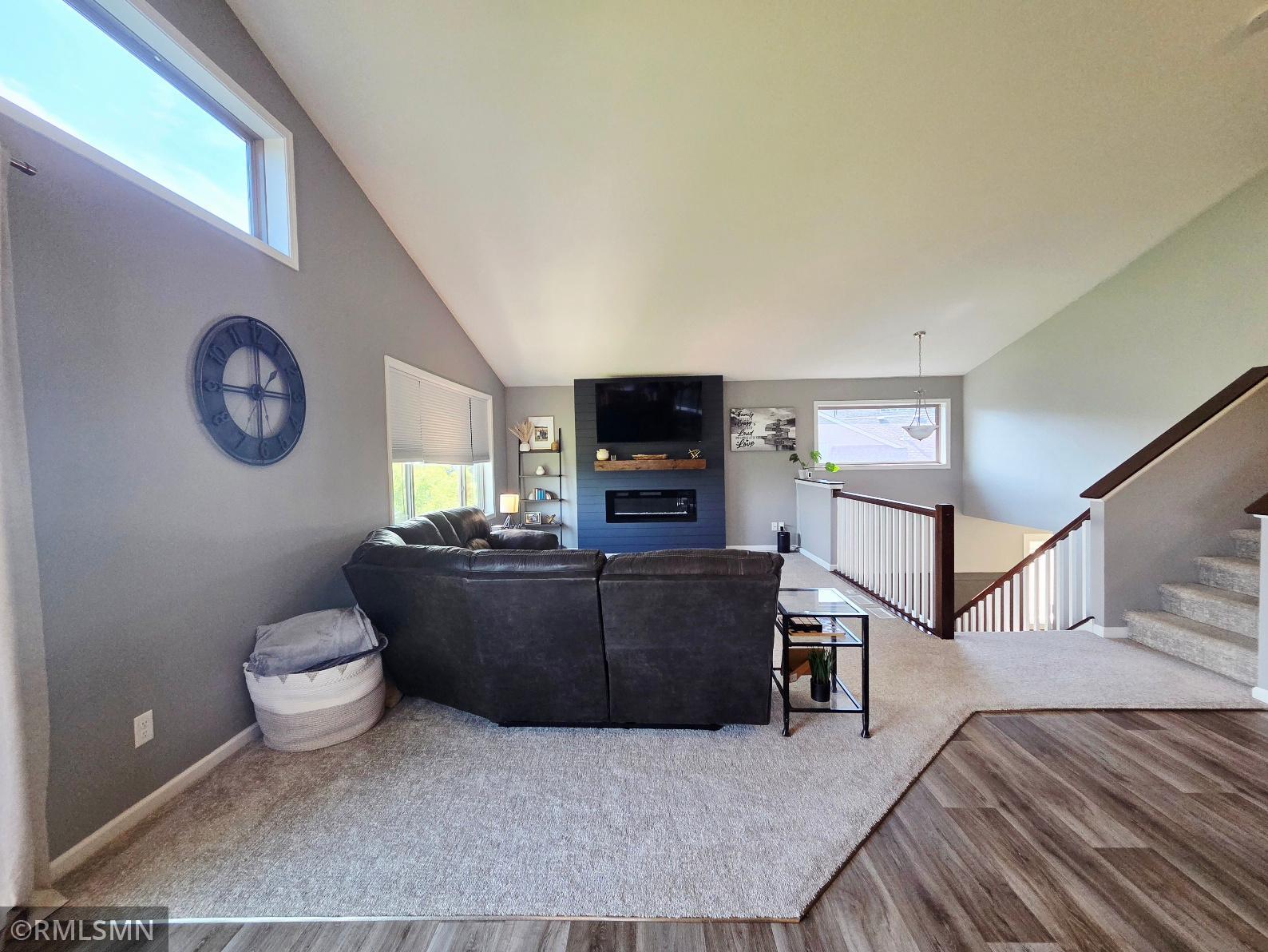 Main level living room with electric fireplace