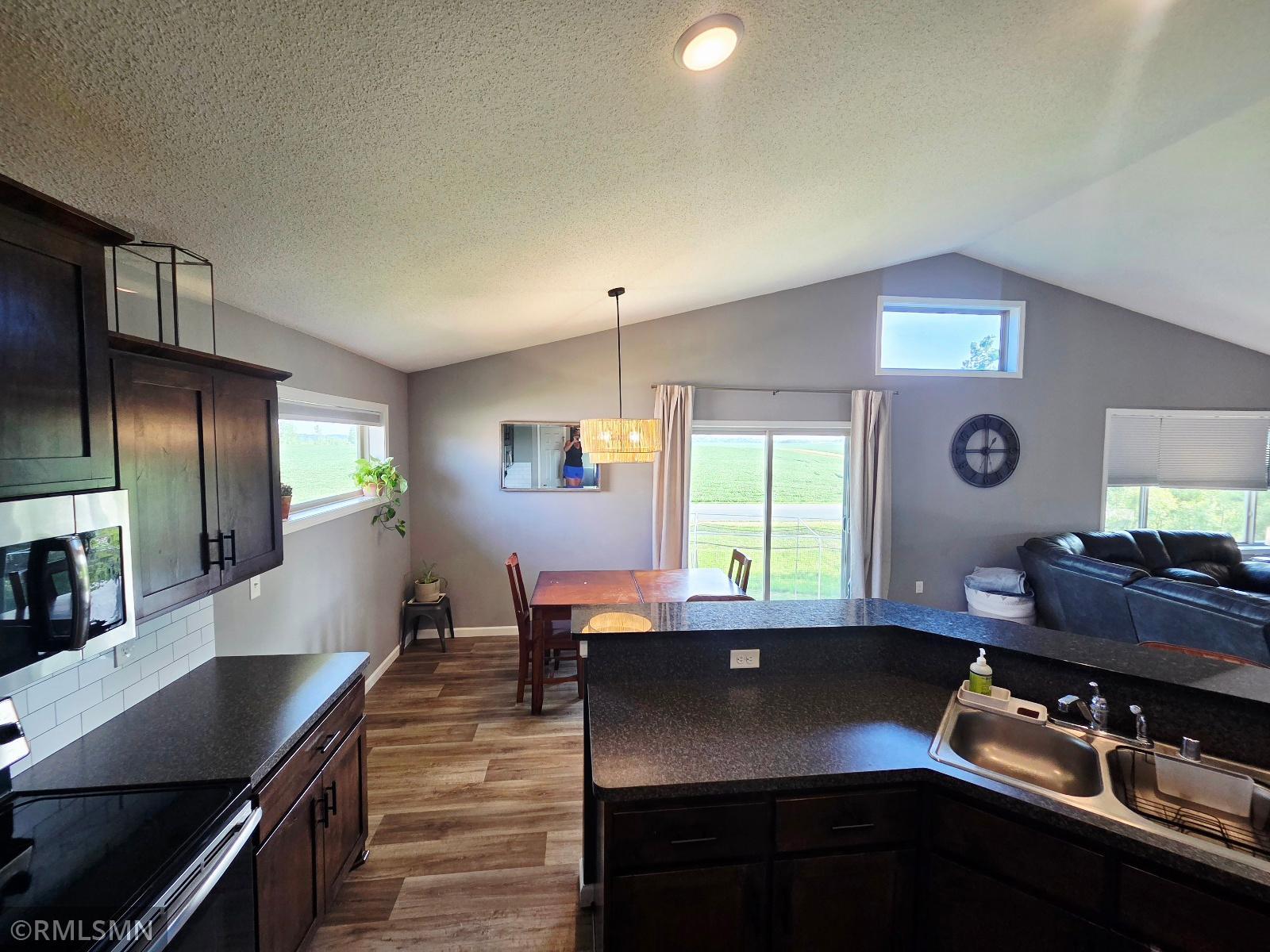 Kitchen island with lookout to patio doors