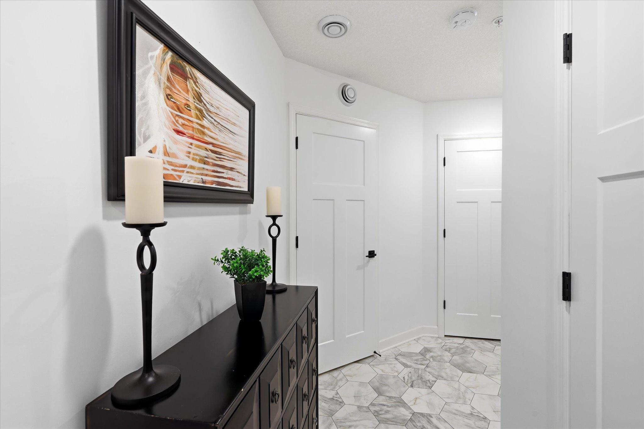 Even the back entry from garage is beautiful and has space for a furniture piece