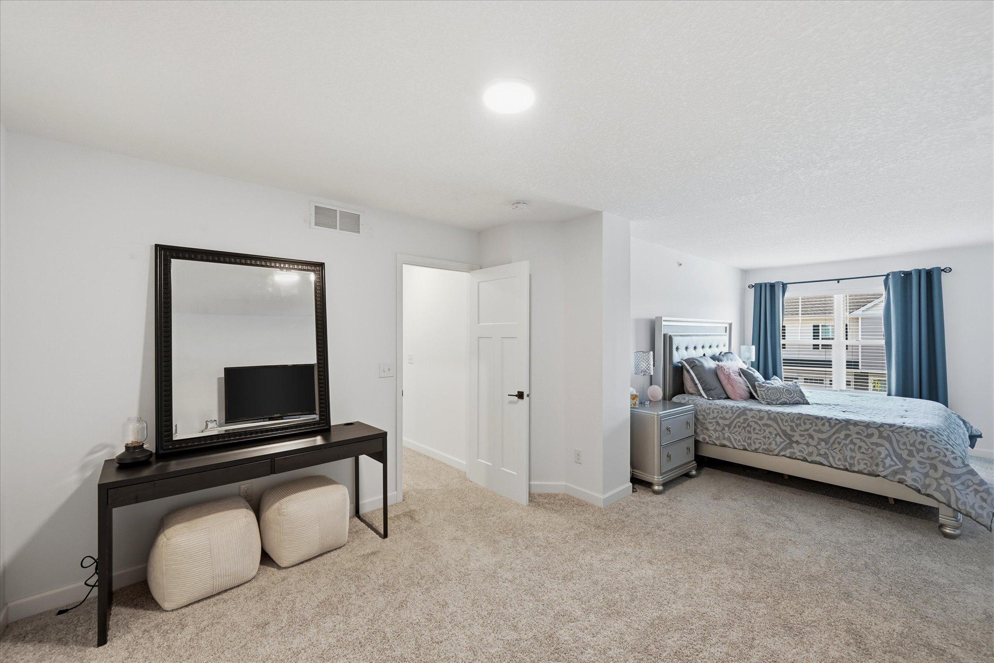 Fabulous primary bedroom has 2 large spaces