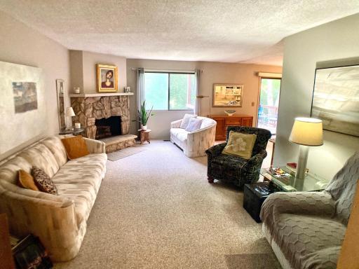 Comfortable living room with wood burning fireplace.jpg
