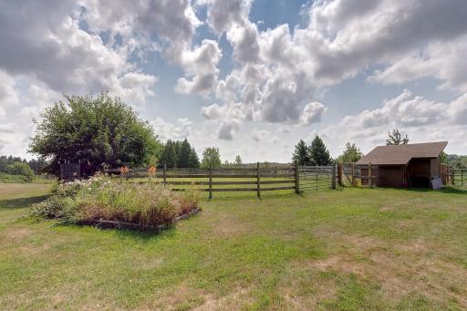 Chicken house, riding arena, and raised flower beds