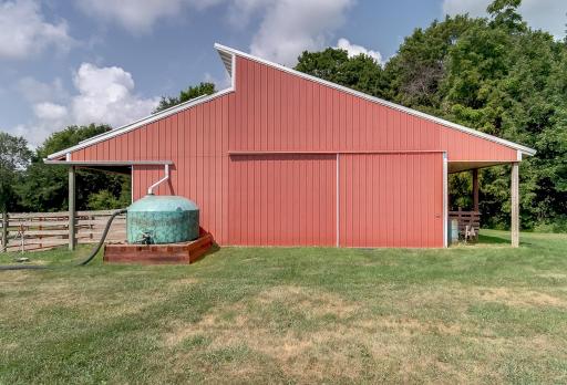 East entrance to barn. 1100 gallon rain water collector