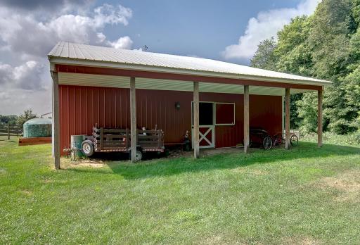 Barn overhang provides shade and extra storage