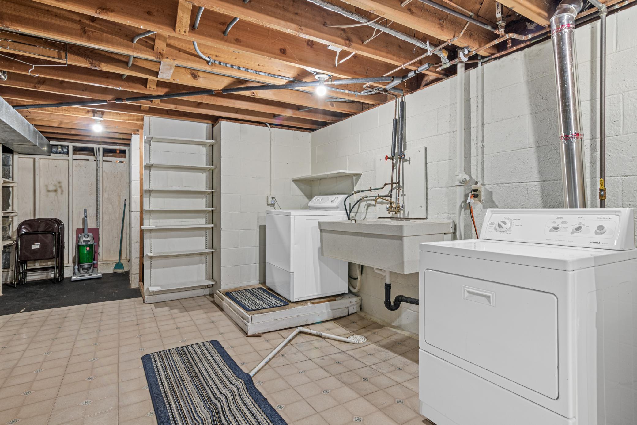 Clean and Spacious Laundry/Utility Room with Massive Storage