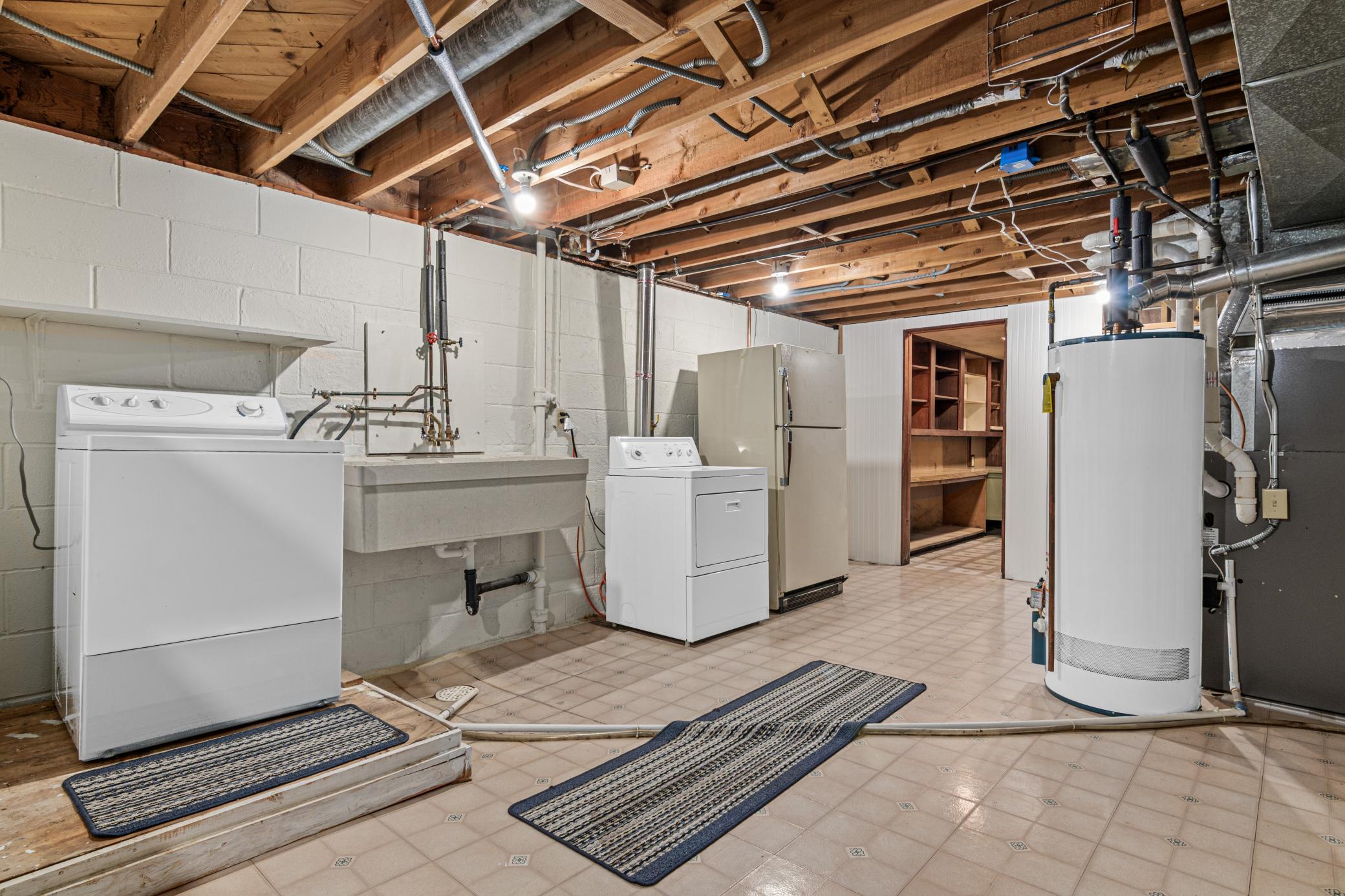 Clean and Spacious Laundry/Utility Room with Massive Storage