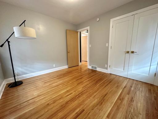Here is the third bedroom. The floors are perfect, the closets have been upgraded with raised panel doors and handles
