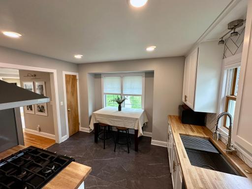 Bright and spacious eat in kitchen, remodeled with shaker cabinets and a pantry