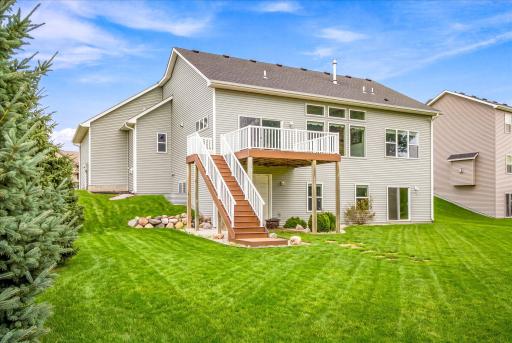 Rear side view home -green grass enhanced.jpg