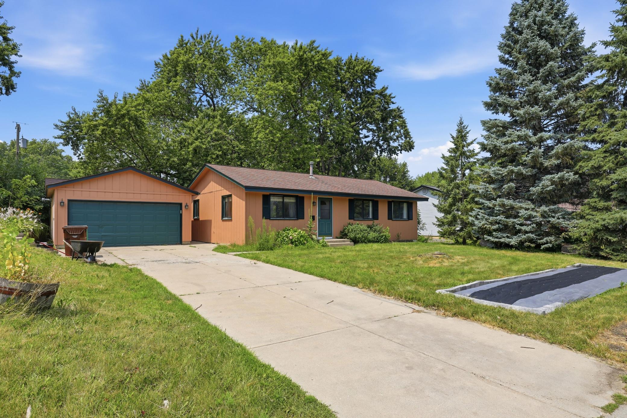 Double garage with concrete driveway