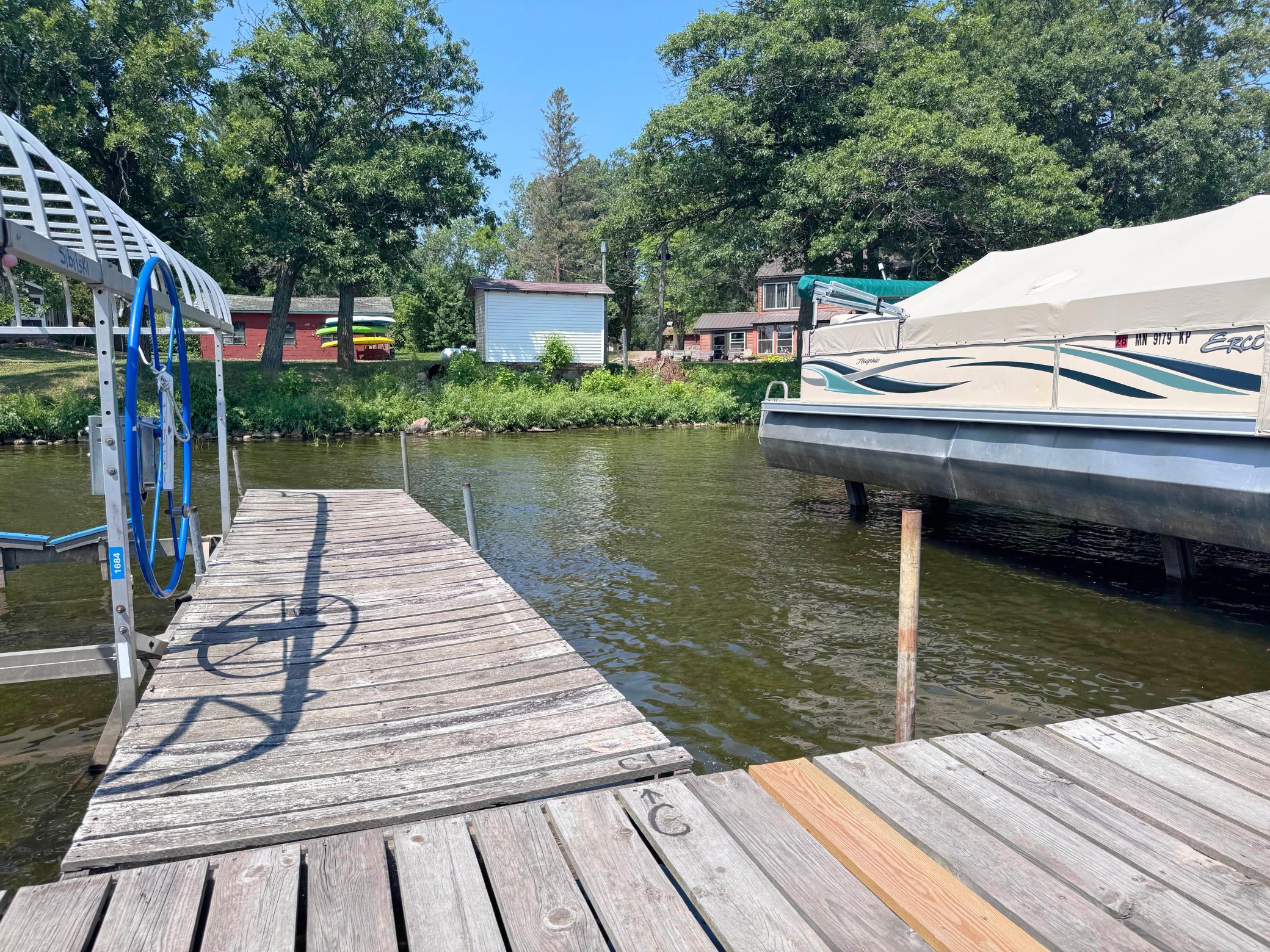 A shot of the boat slip on the dock associated with this property, the empty slip on the right goes with this unit.