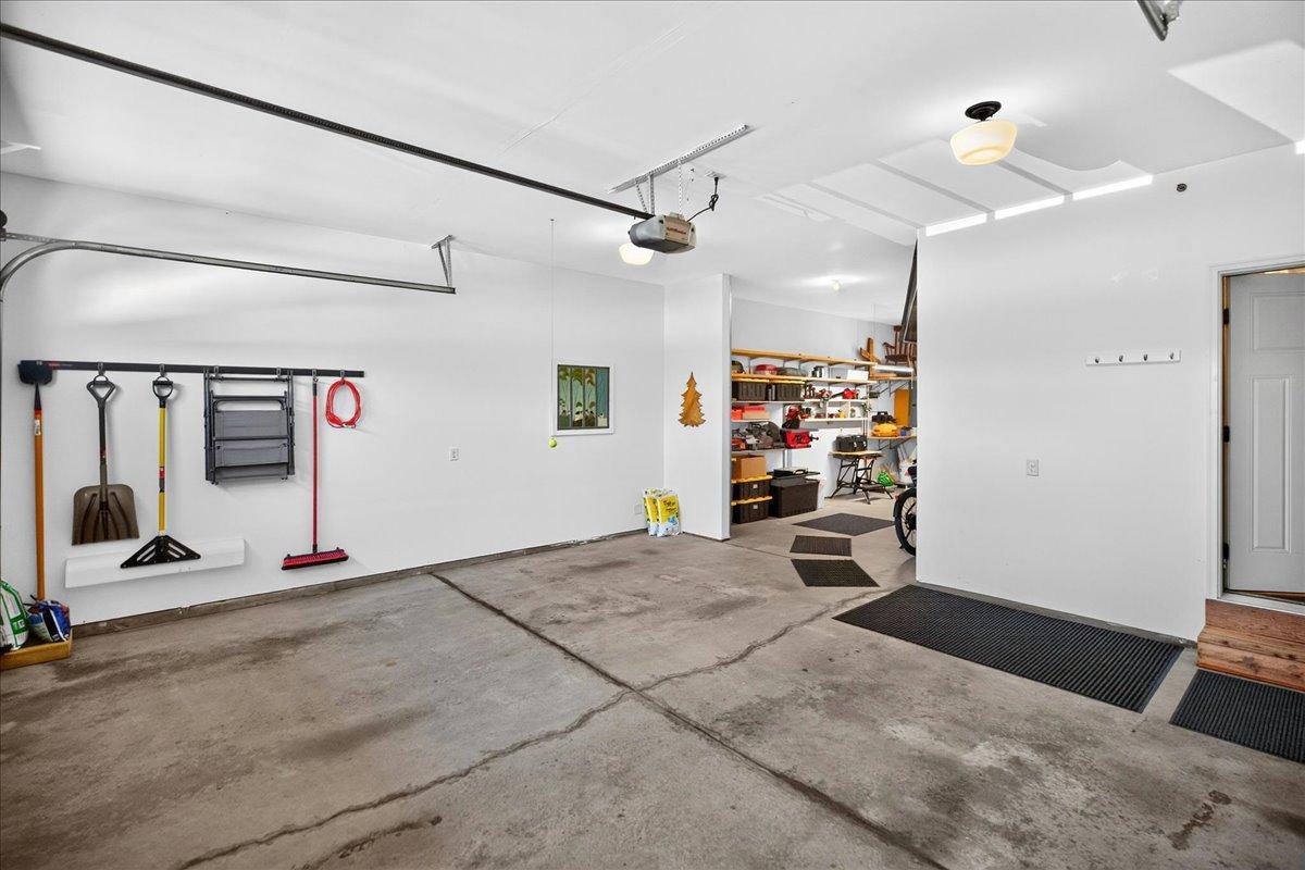Three car garage, with the third stall tandem.