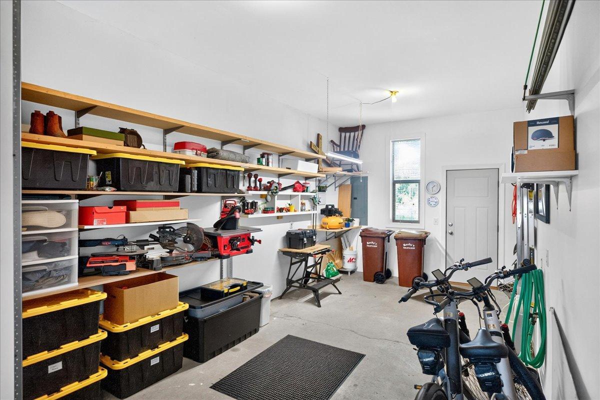 Third stall currently being used as a workshop! Walks out onto small deck in rear of townhome.