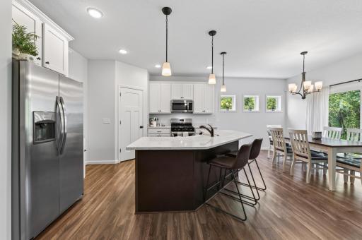 Spacious Kitchen with Stainless Appliances, Ample Cabinet Storage and Full Pantry