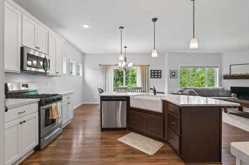 Farmhouse Sink, Decorative Lighting and Open Views Makes this Kitchen the Gathering Place