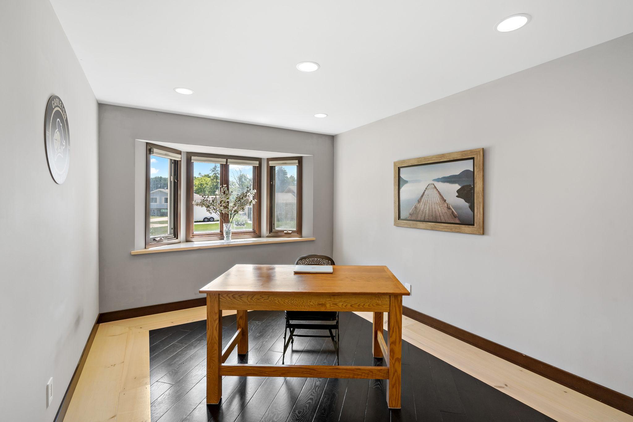 Front room is staged as an office, but would also work perfectly as a dining space