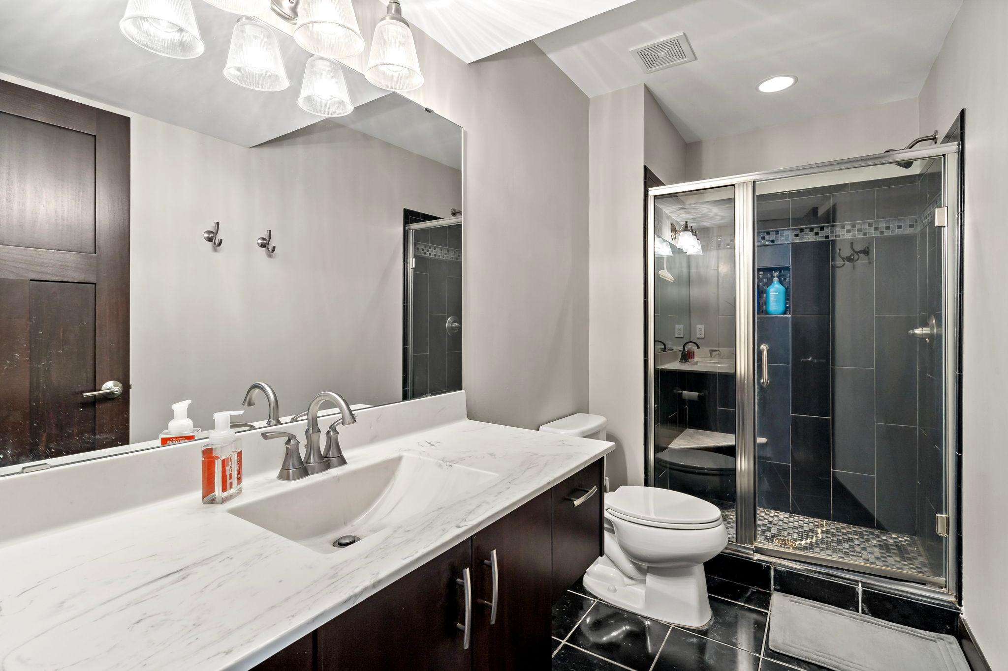 3/4 bathroom at the lower level... fully tiled!