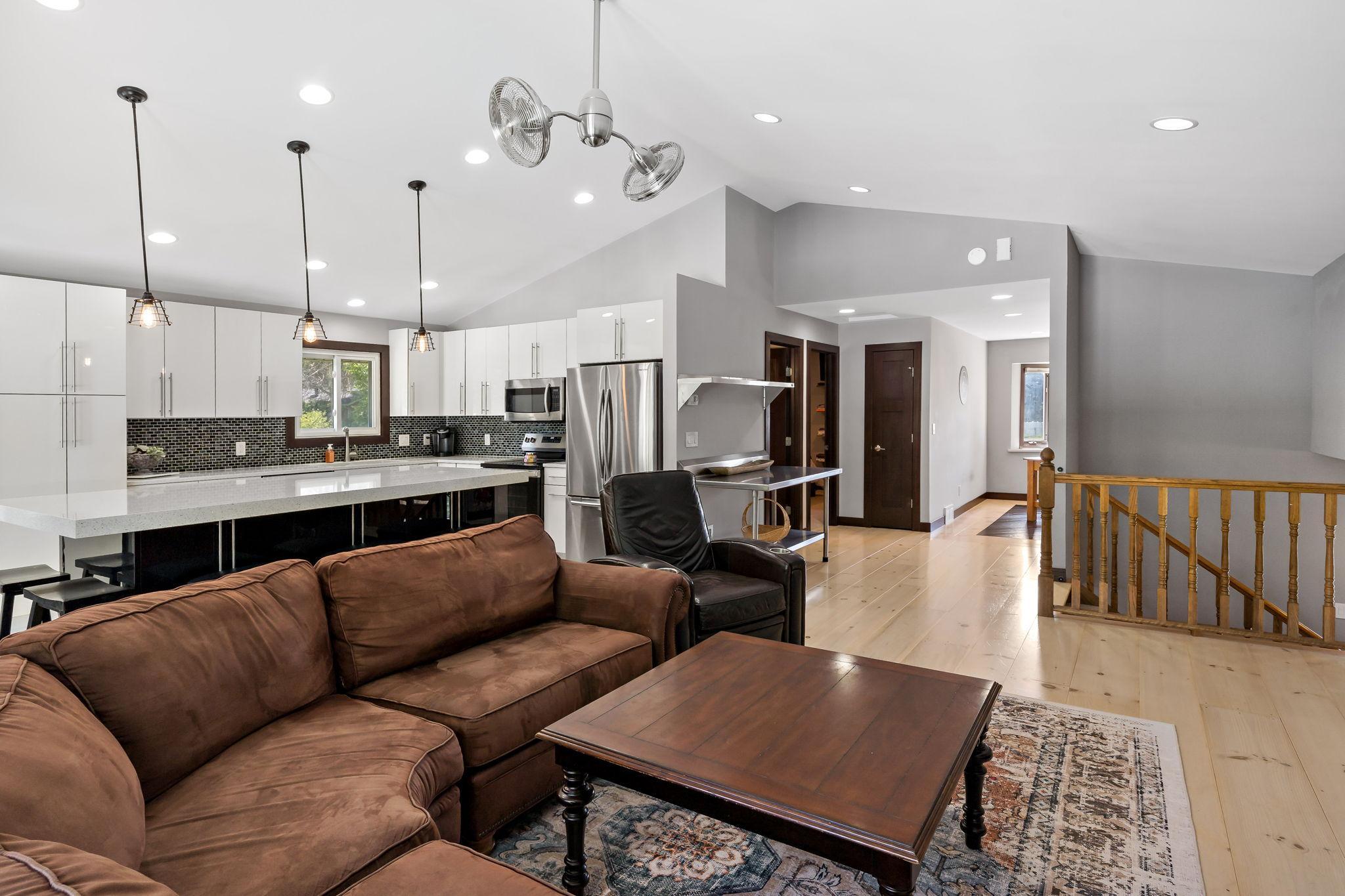 The front side of the house features an office or dining space, primary bedroom and full bathroom