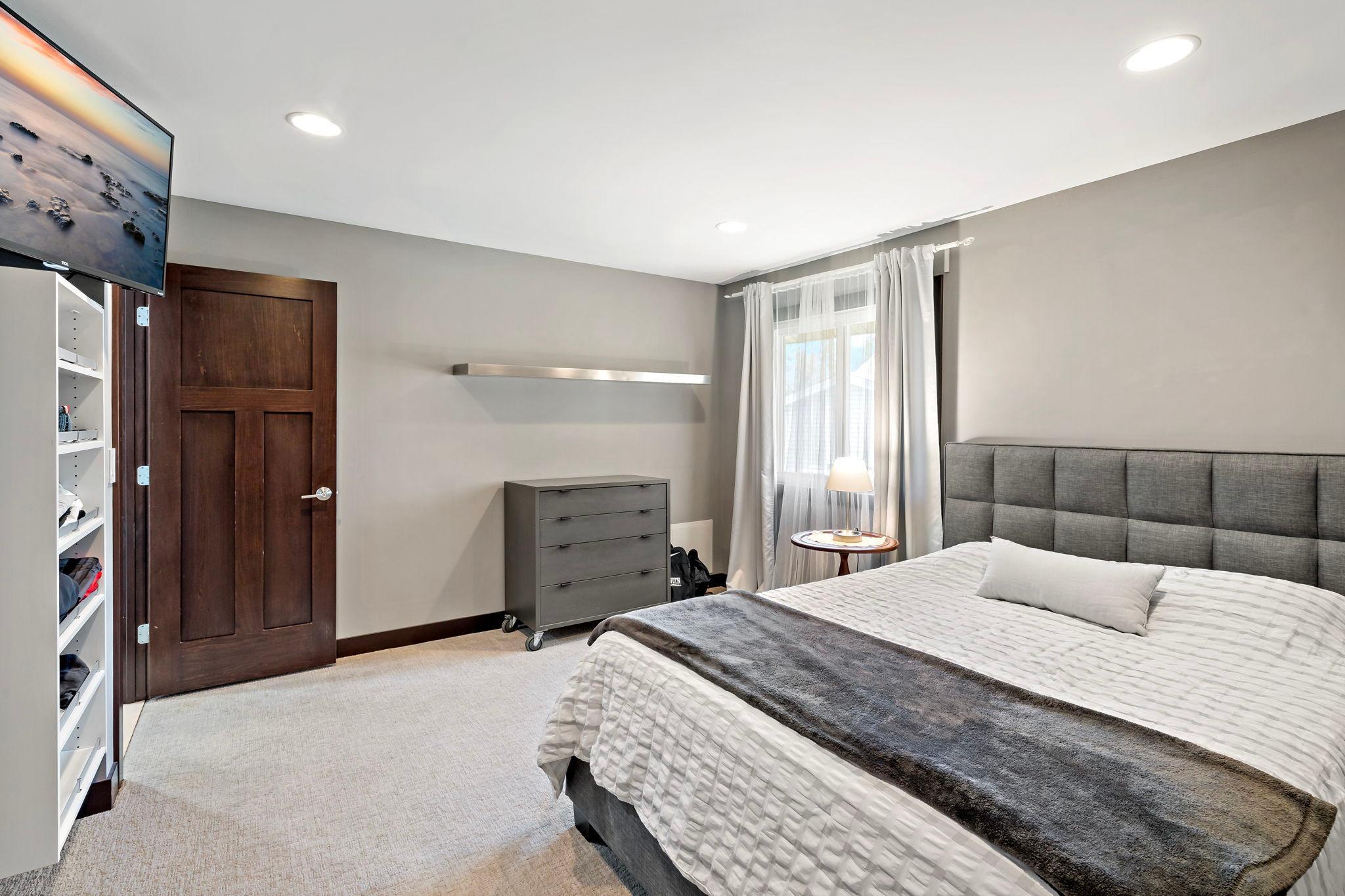 Recessed lighting and low profile carpeting featured in the primary bedroom