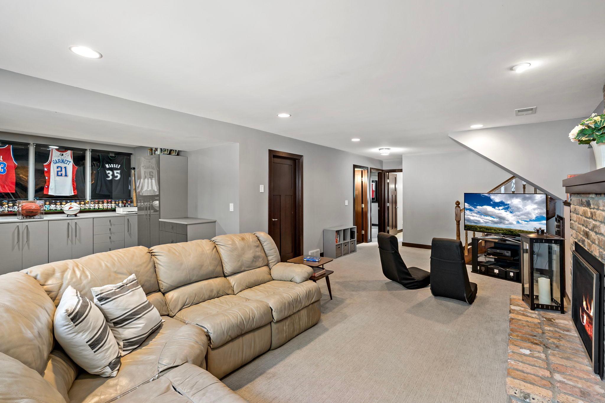 Abundant recessed lighting and low profile carpet included throughout the lower level