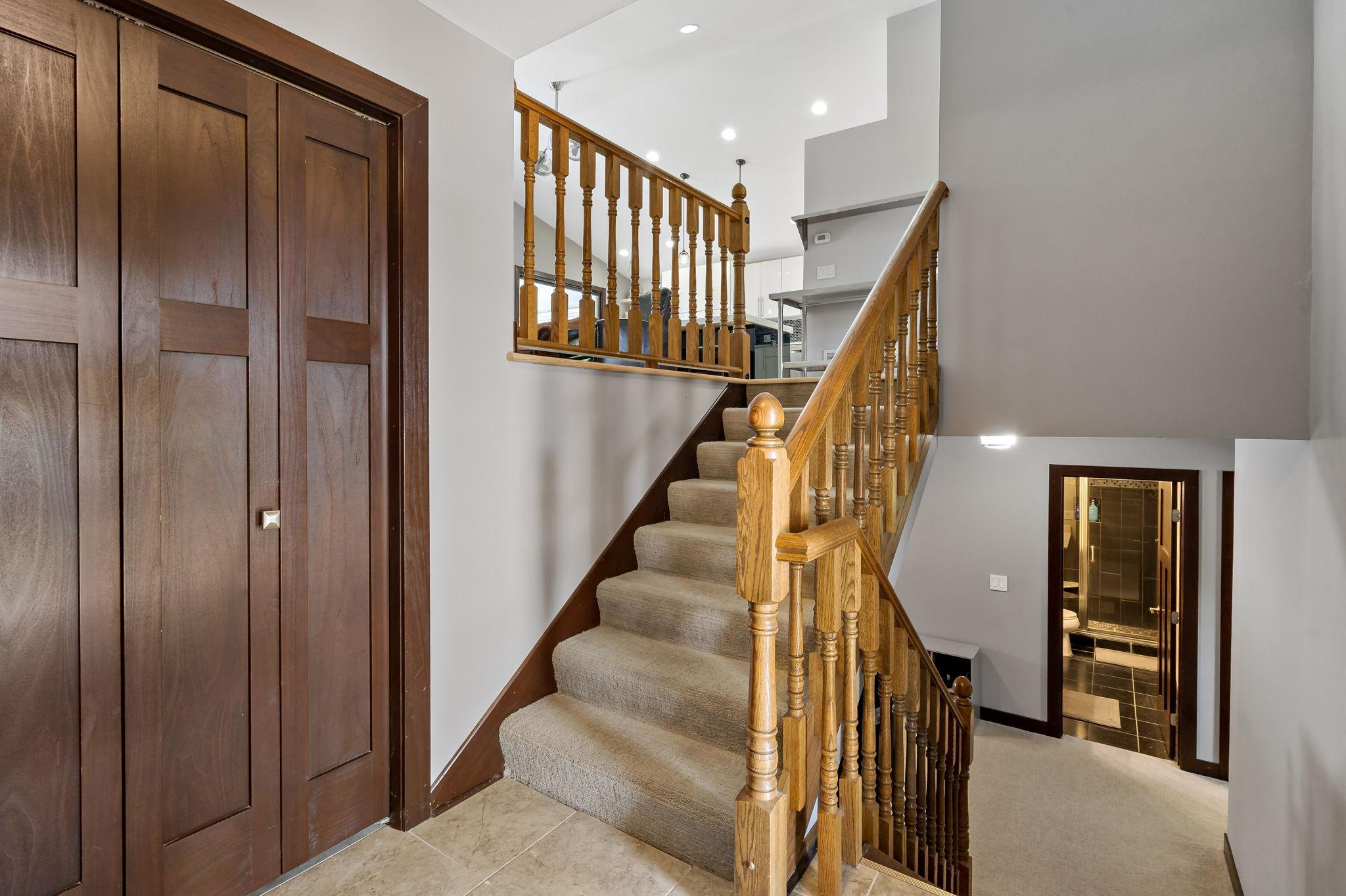 Closet in the foyer with paneled wood doors