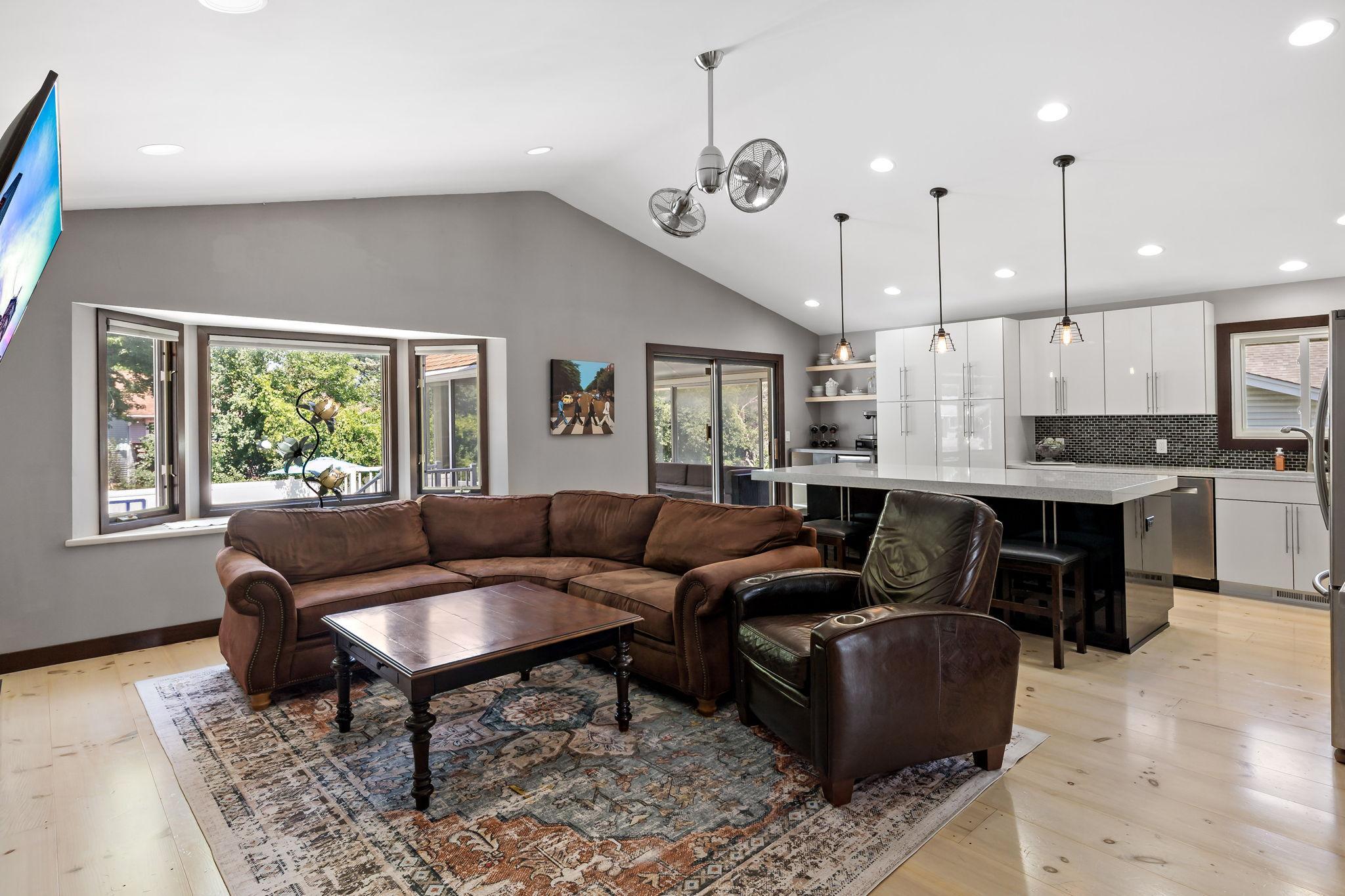 Open concept floor plan from great room, to beautifully updated kitchen, and out to the sunroom