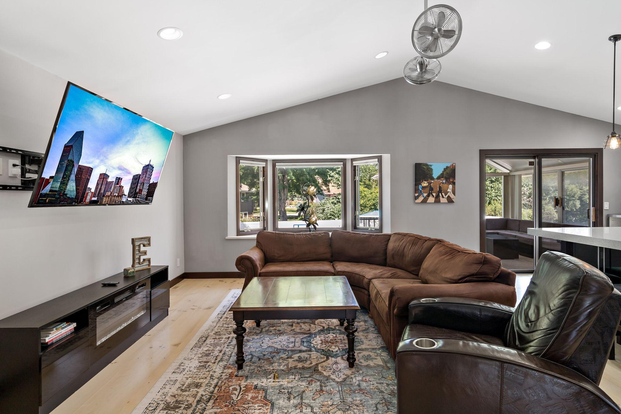 HUGE upper level great room with lots of natural and recessed lighting is made complete with vaulted ceilings