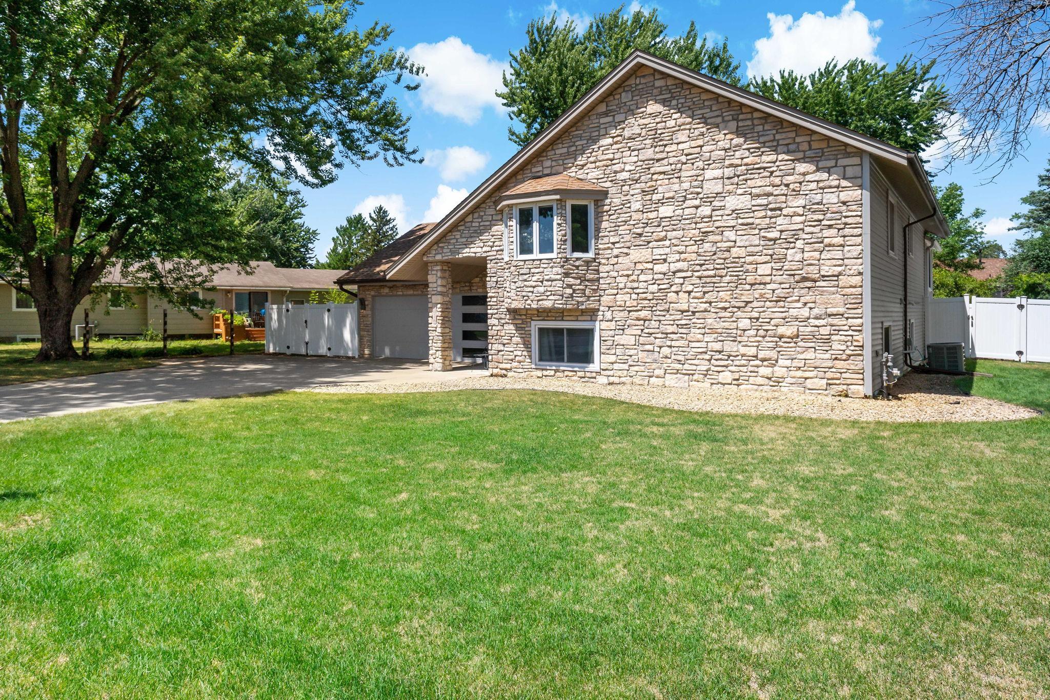Rock border along the front and right elevations completes sizable front yard