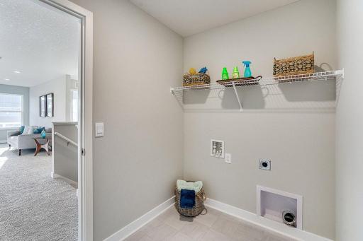 Conveniently located upstairs laundry. Photo of model home, color and options will vary.