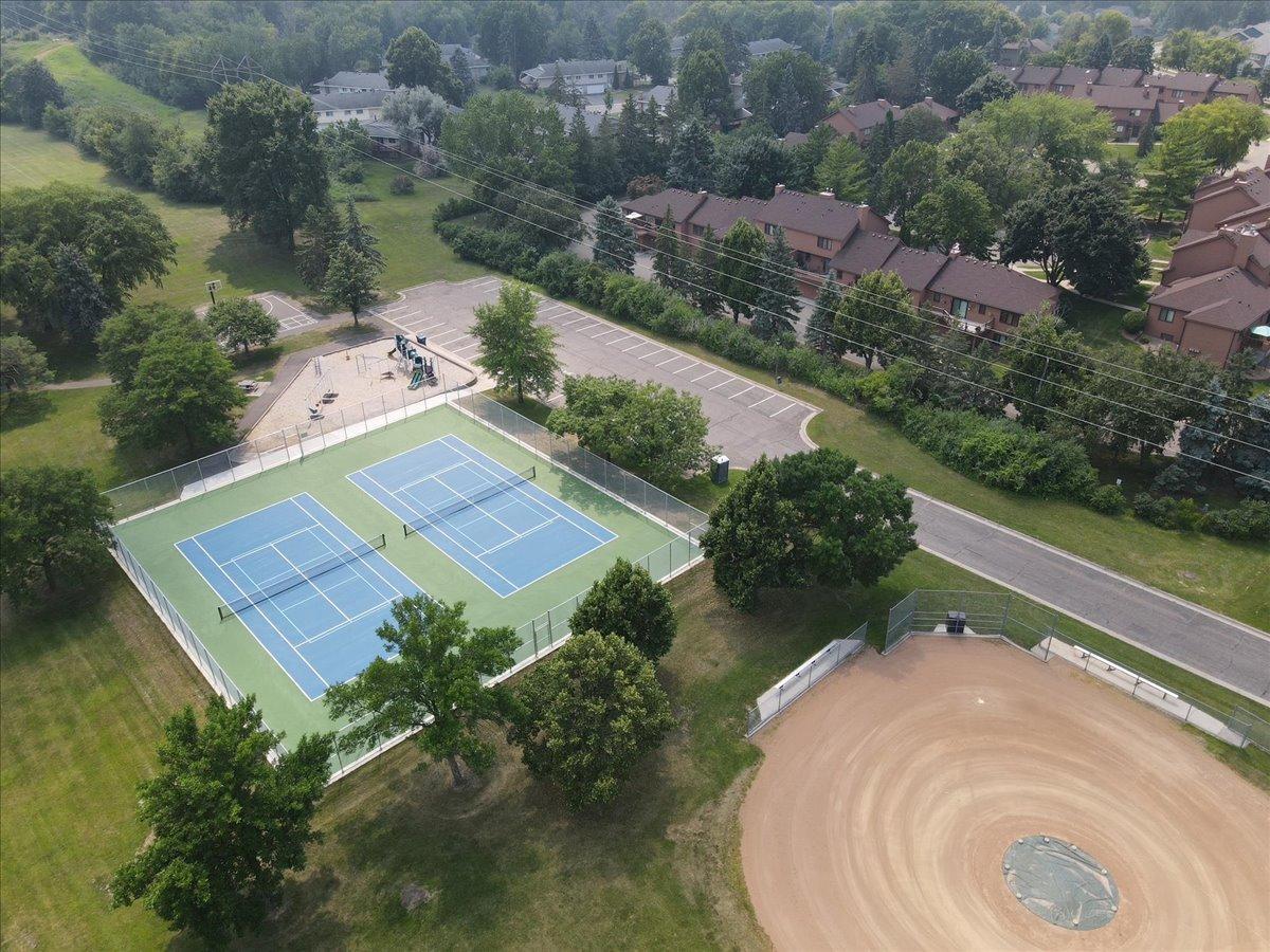 TENNIS COURTS RE SURFACED