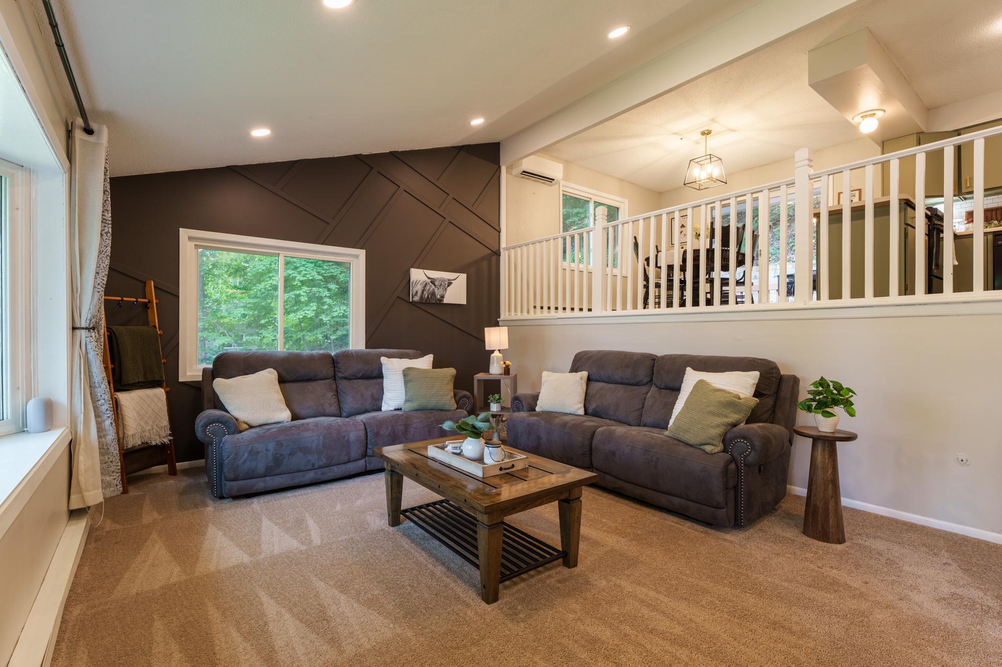 Step through the front door into the welcoming foyer and living room, then head upstairs where the kitchen overlooks the living room, creating an open feel that's perfect for everyday life and entertaining.