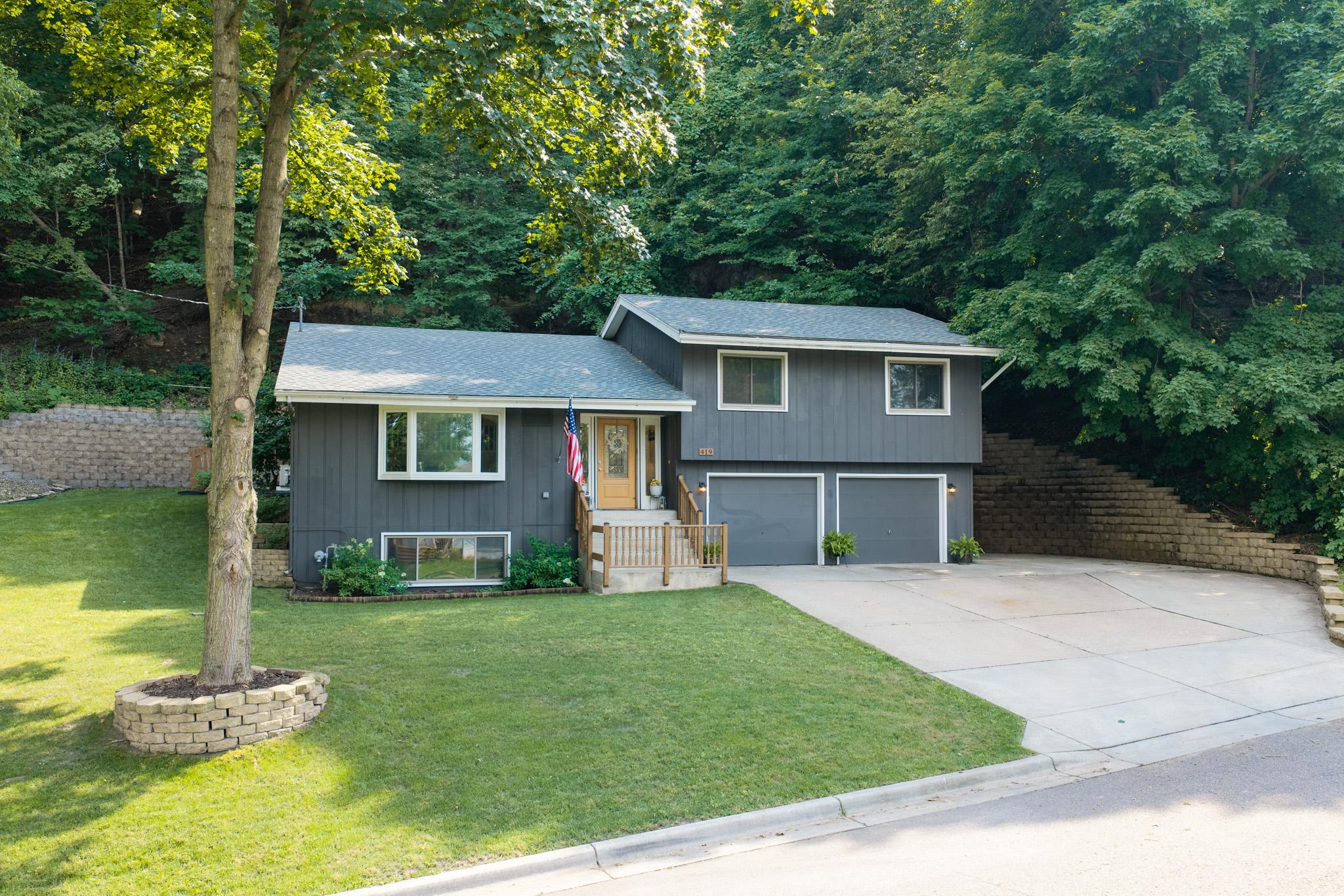 Tucked at the end of a cul-de-sac and backed by a wooded bluff instead of another row of houses, this home sits in a setting that's becoming increasingly hard to find.