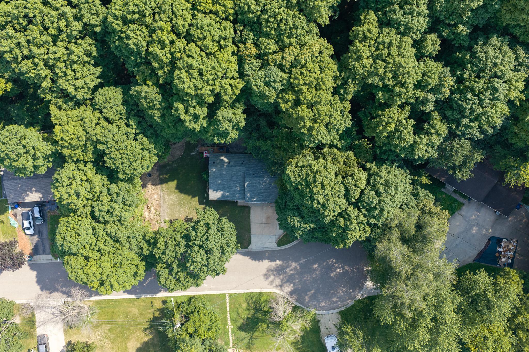 Outside, enjoy peace of mind with a newer roof (2022), refreshed landscaping, a freshly painted deck and front railing, updated exterior lighting, an attached two-car garage, plus an extra concrete parking pad.
