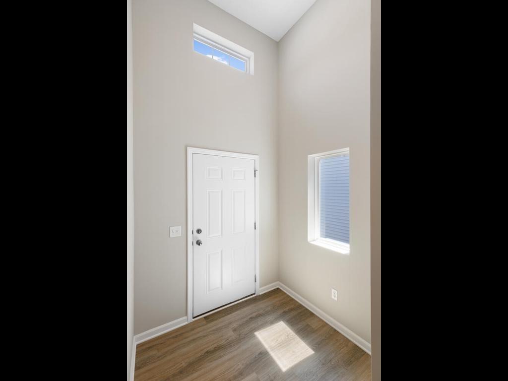Foyer. Photo taken of another home with similar plan and finishes. Photos and renderings may not depict actual plan, materials, & finishes may vary. All measurements are approximate.