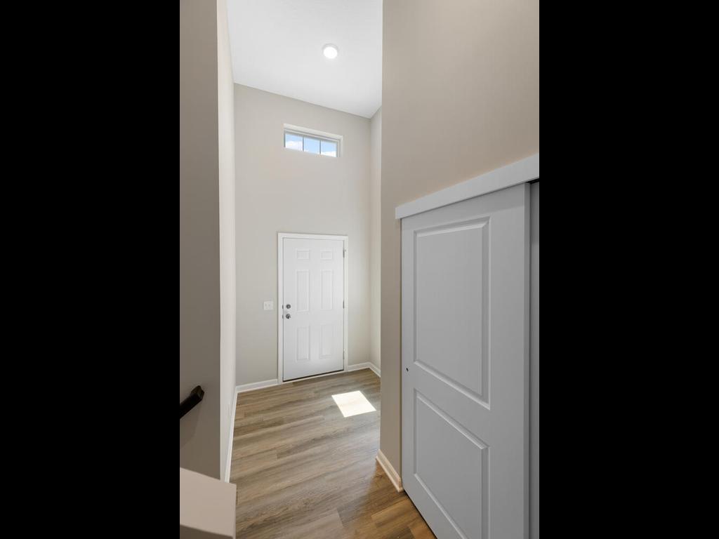 Foyer. Photo taken of another home with similar plan and finishes. Photos and renderings may not depict actual plan, materials, & finishes may vary. All measurements are approximate.
