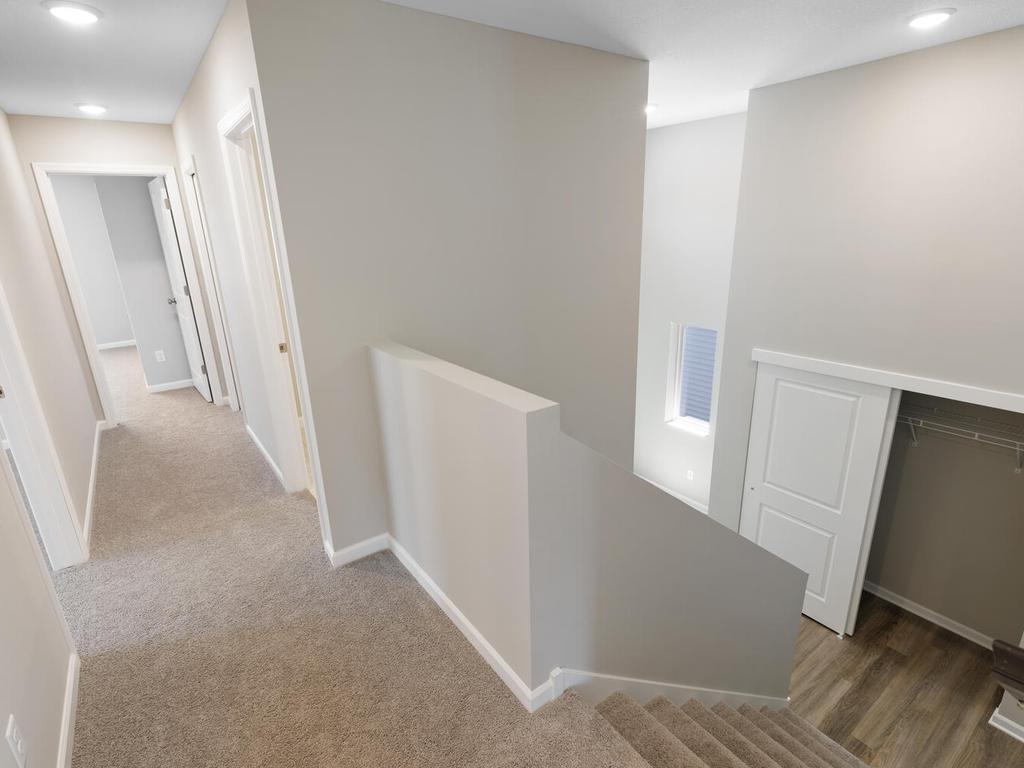 Foyer. Photo taken of another home with similar plan and finishes. Photos and renderings may not depict actual plan, materials, & finishes may vary. All measurements are approximate.