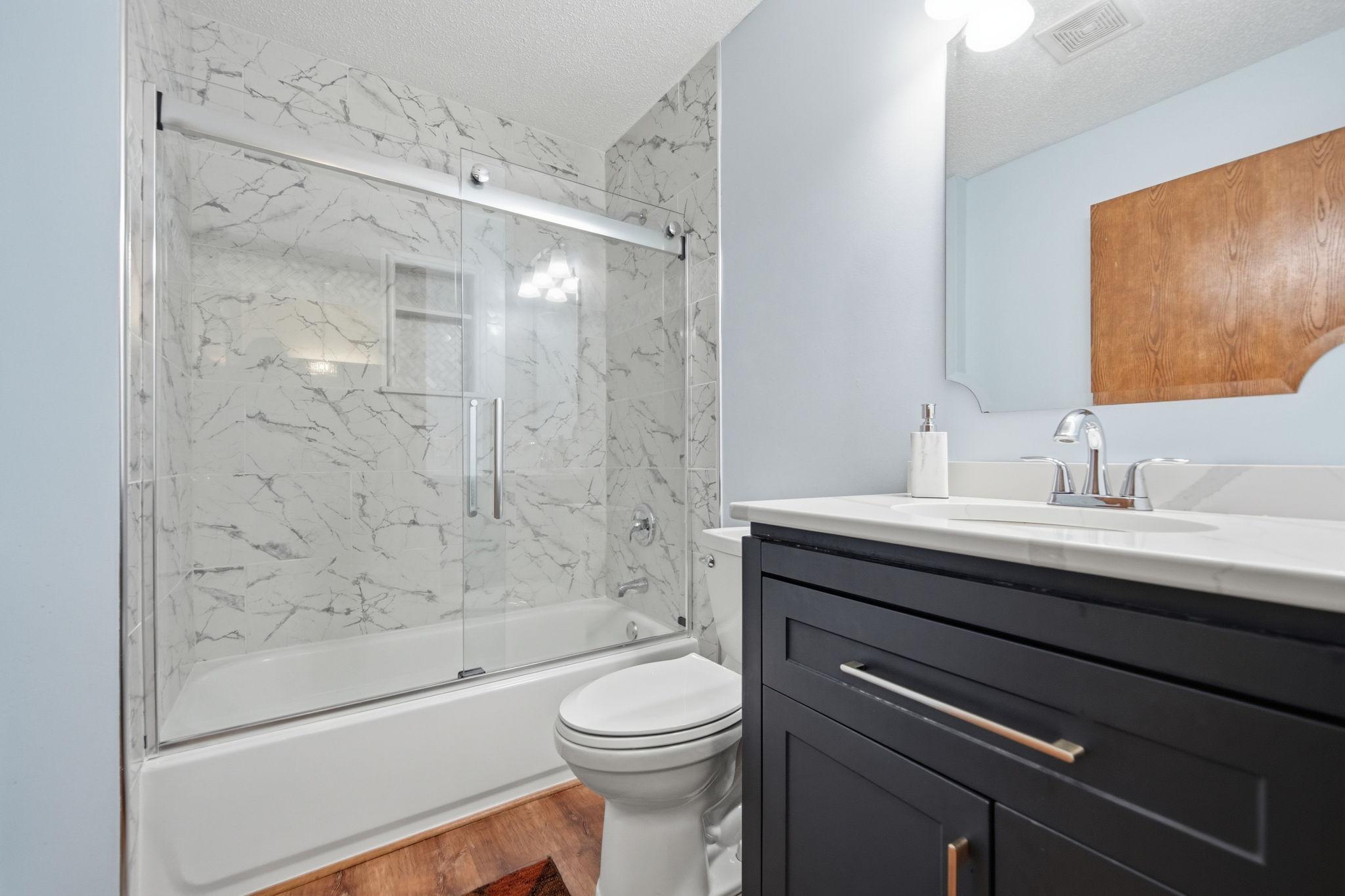 Main floor full bathroom- Recently remodeled from top to bottom.