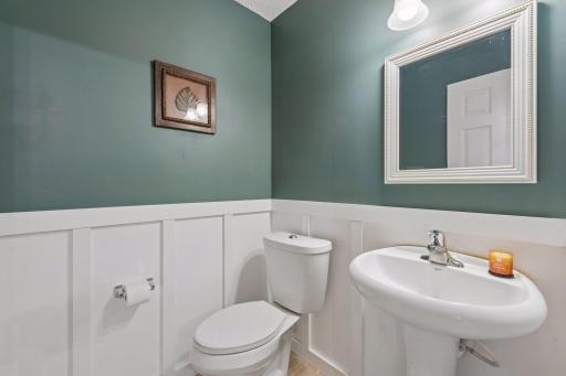Main floor powder room with wainscoting. All toilets have been replaced.