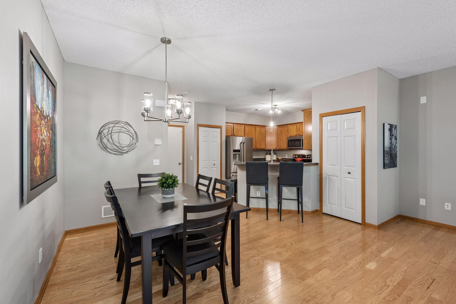The dining room is quite large. This table seats 6 with room for more. Plus you will enjoy informal seating at the breakfast bar.