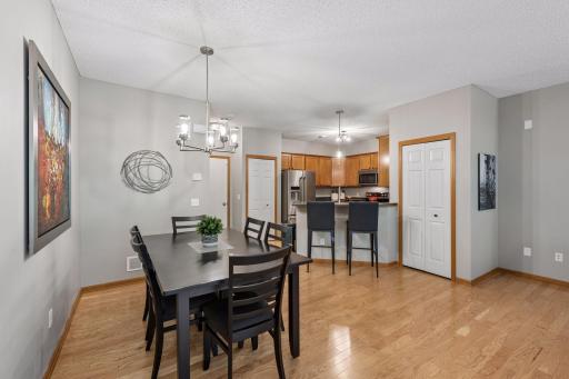 The dining room is quite large. This table seats 6 with room for more. Plus you will enjoy informal seating at the breakfast bar.