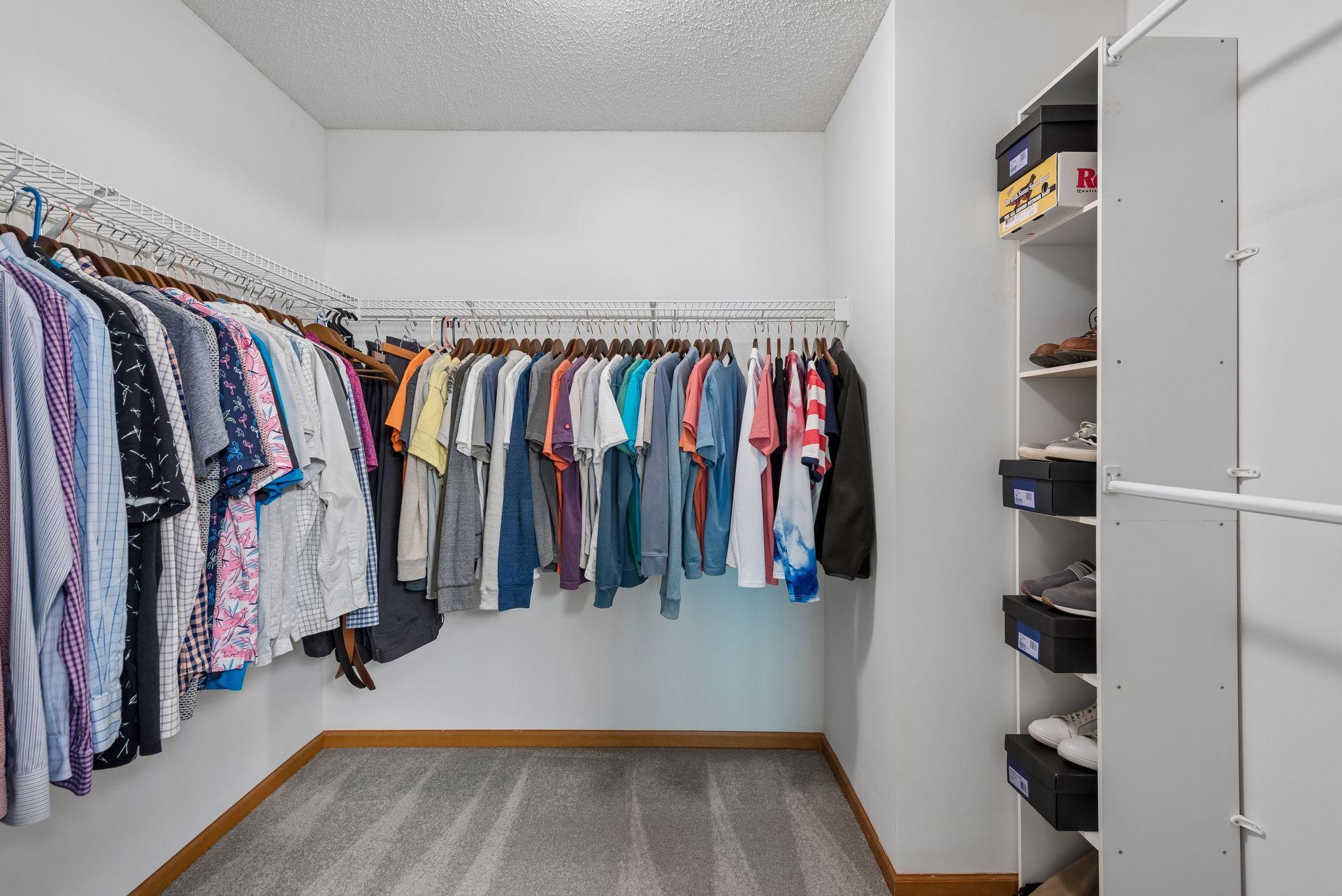 Primary walk-in closet is spacious with lots of options.
